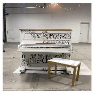 Piano with letters collage and gold accents